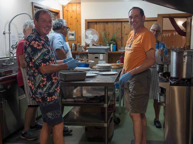 People cooking in the hall kitchen